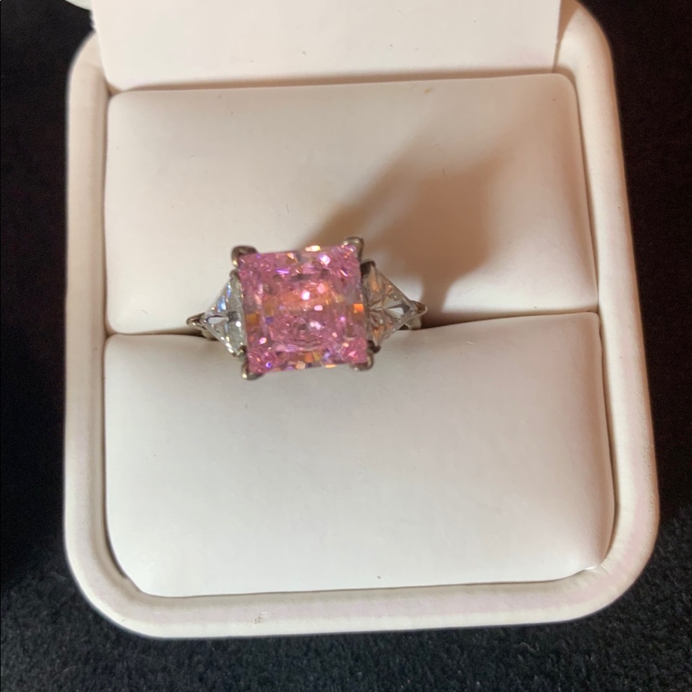 Pink stone set in silver. Feminine. Eye catching.